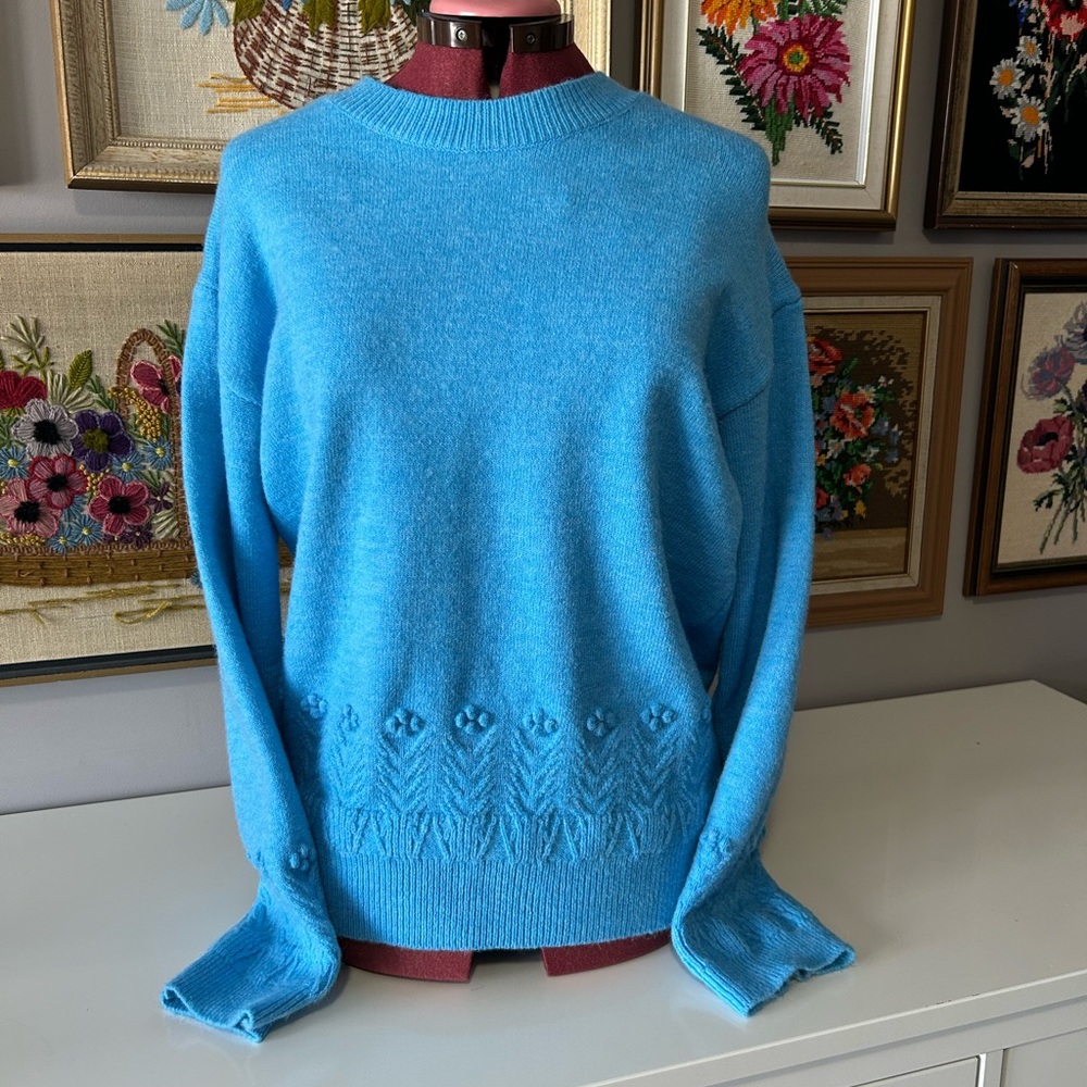 Woman’s blue wool blend sweater. No tag but likely a woman’s large.